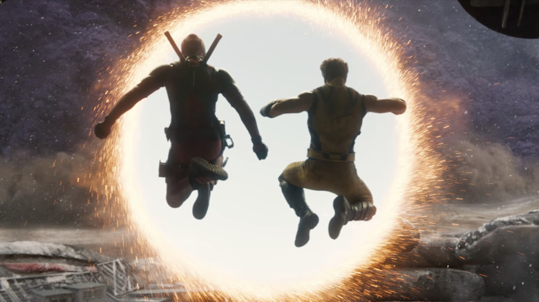 Deadpool and Wolverine leaping through portal