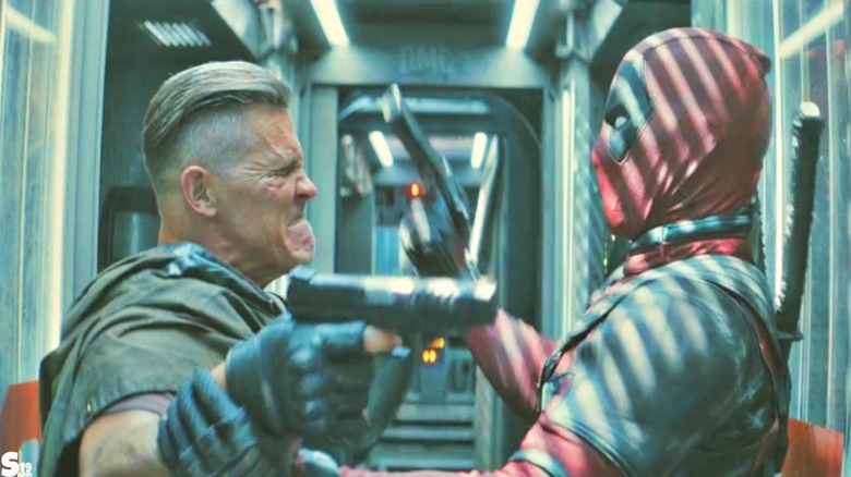 Deadpool fighting Cable on prison transport