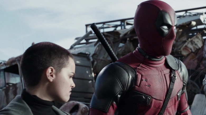 Negasonic Teenage Warhead and Deadpool charging into battle