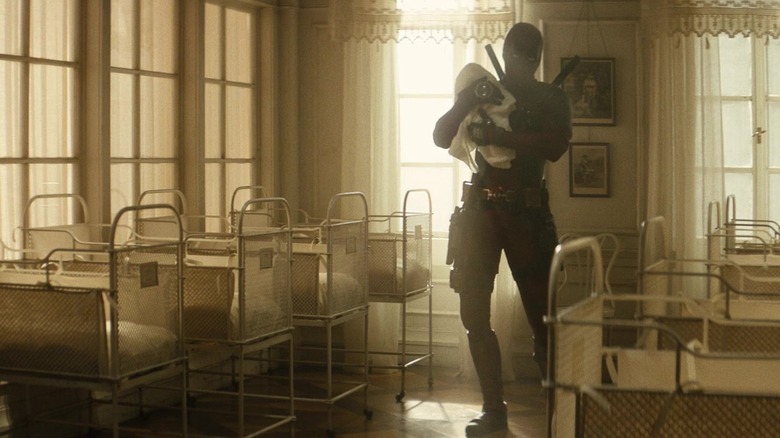 Deadpool cradling baby Hitler