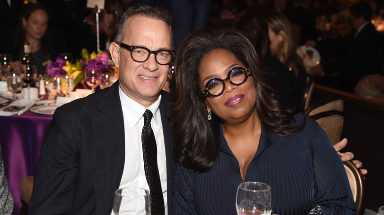 Tom Hanks and Oprah Winfrey smiling