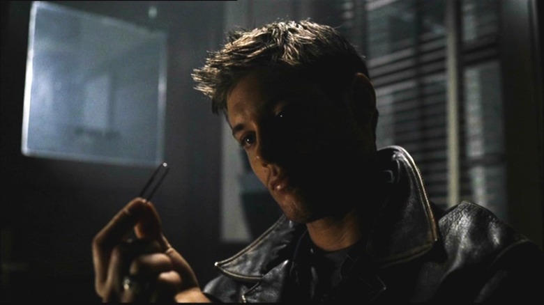 Dean holding paperclip