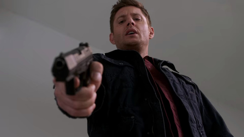 Dean holding gun