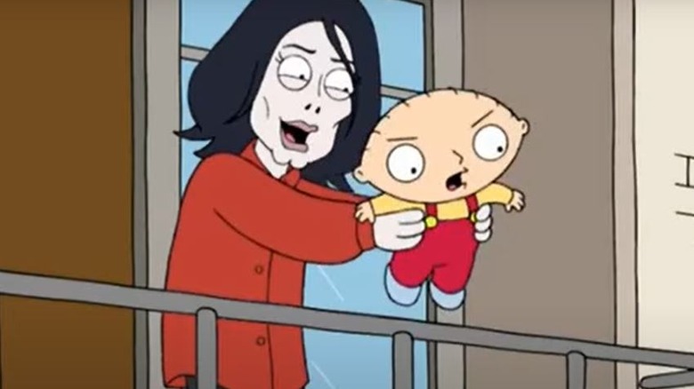 Michael Jackson holding Stewie Griffin