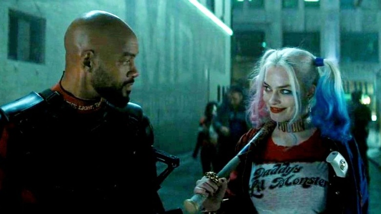 Deadshot and Harley walk in an alley