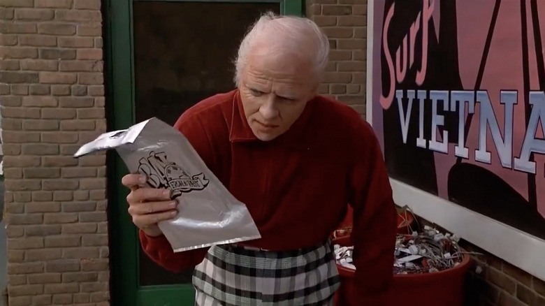 Biff holding sports almanac