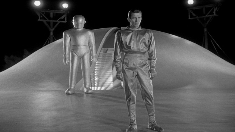 Klaatu and Gort stand on the ship