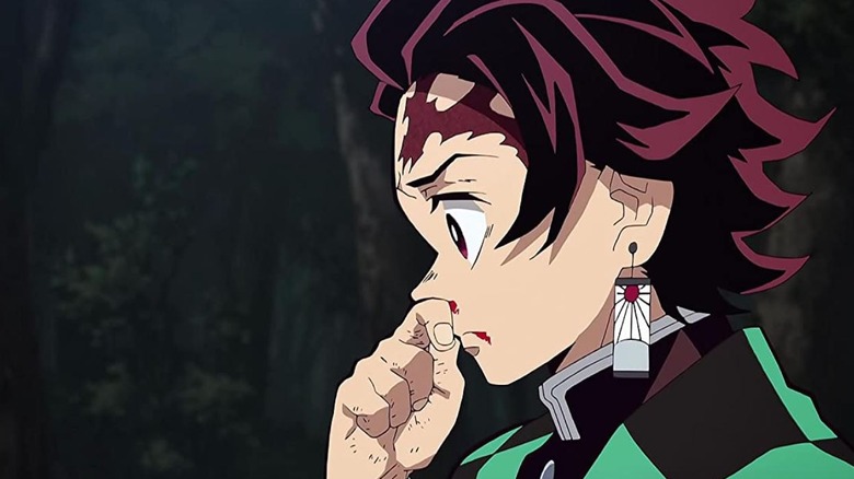 Tanjiro holding his nose