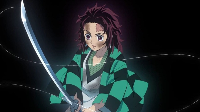 Tanjiro holding his sword