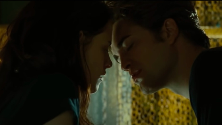 Edward leaning in to kiss Bella