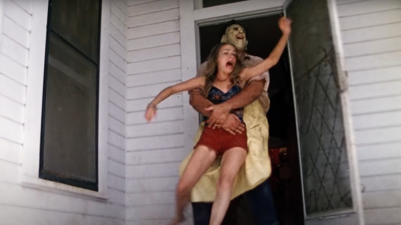 Leatherface grabs Pam