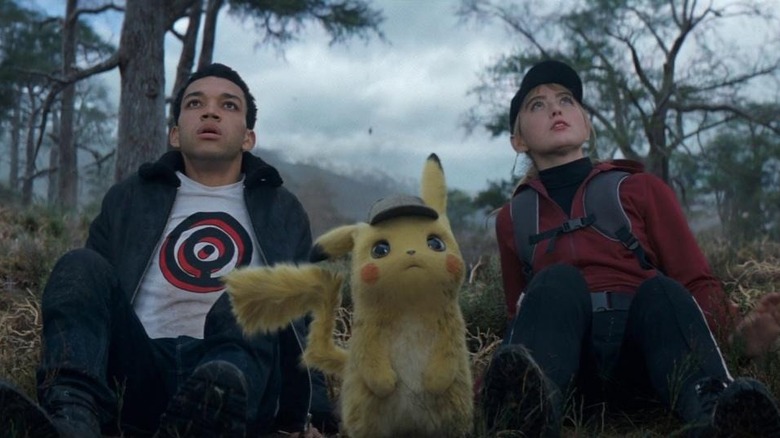 Justice Smith and Kathryn Newton with Pikachu