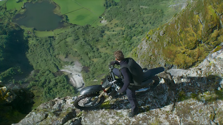 Ethan Hunt staring down cliff on motorcyle