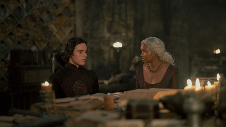 Jacaerys and Baela talking and sitting at a table in House of the Dragon