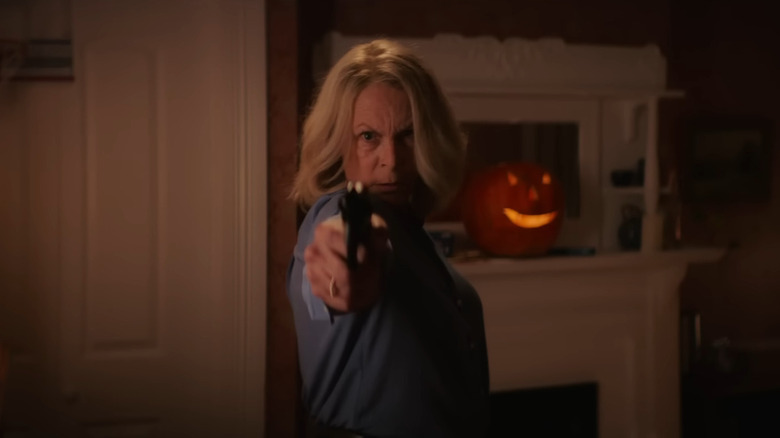 Laurie pointing a gun in Halloween Ends