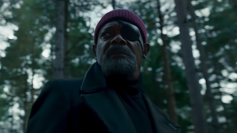 Nick Fury walks through the woods