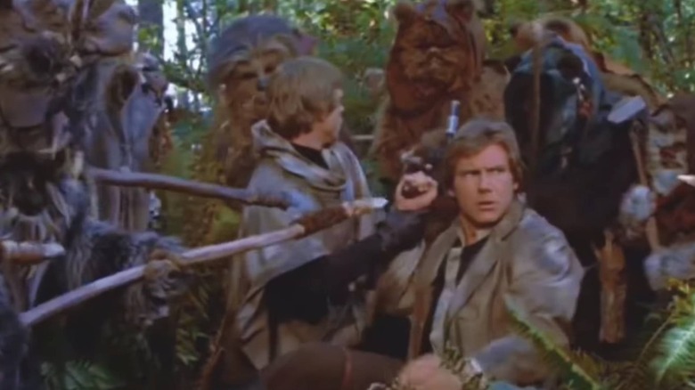 Ewoks surround Han and Luke