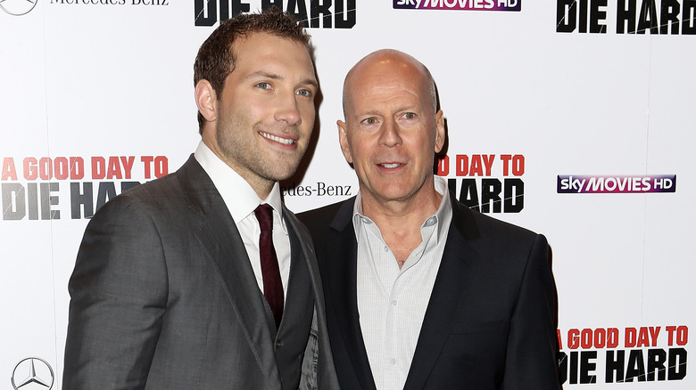 Bruce Willis and Jai Courtney smile at film premiere 