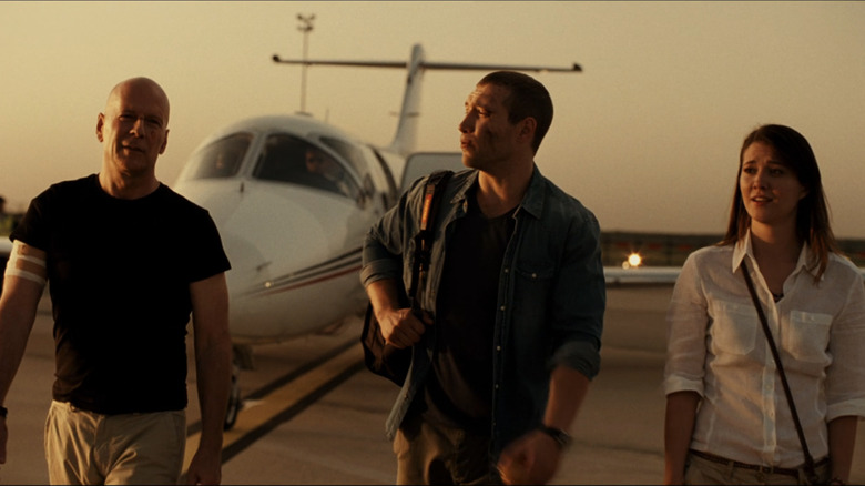 John, Jack, and Lucy on a tarmac