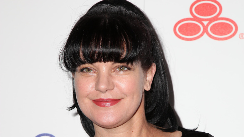 Pauley Perrette smiling for press