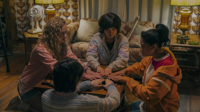 Friends using a ouija board in My Best Friend's Exorcism