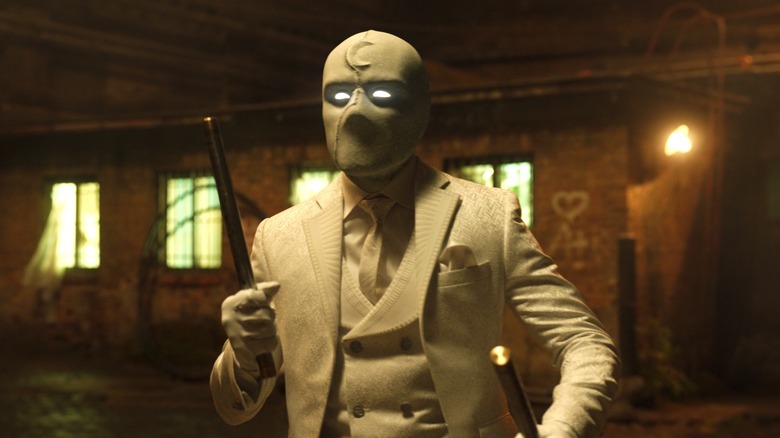 Oscar Isaac holding weapons in "Moon Knight"