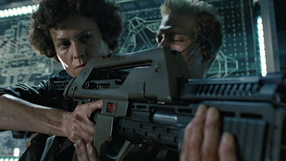 Ripley holding gun