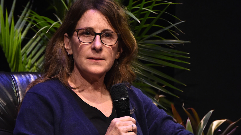 Nicole Holofcener holding microphone