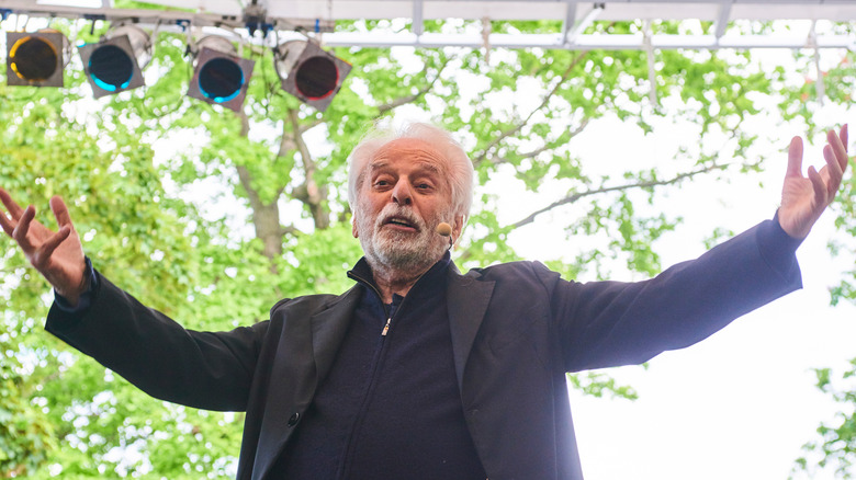 Alejandro Jodorowsky spreading arms