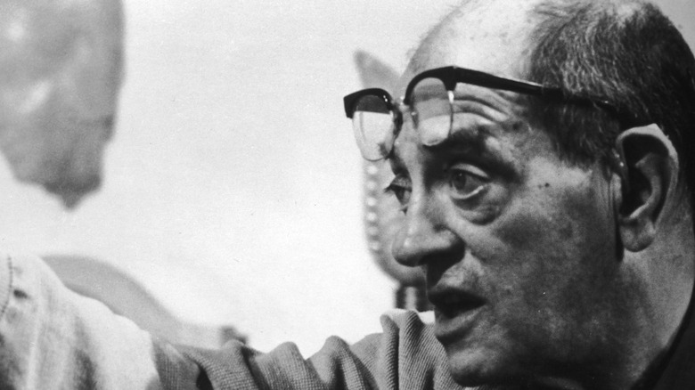 Luis Bunuel with glasses on forehead