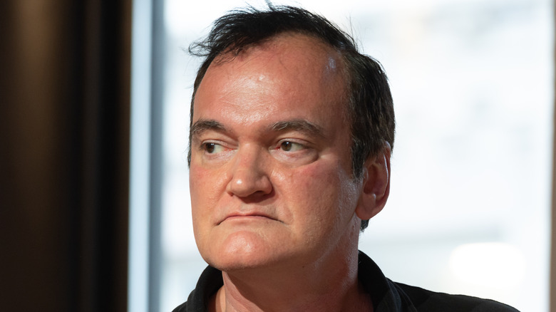 Quentin Tarantino looking