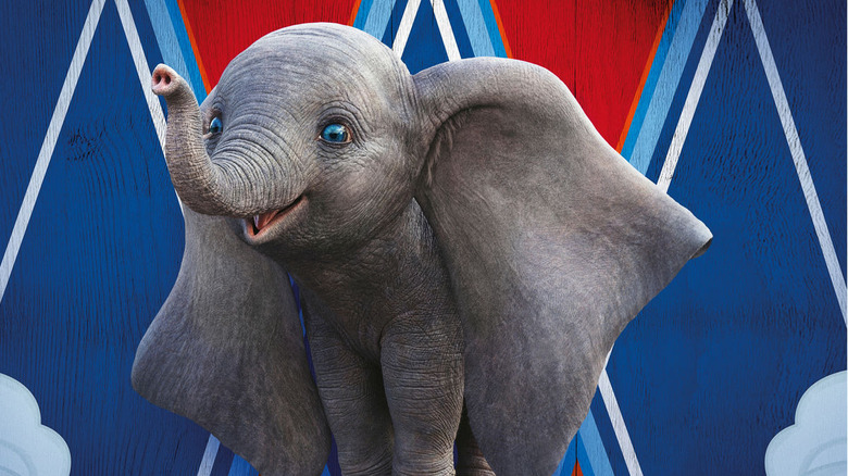 Dumbo smiling near circus tent in "Dumbo" (2019)