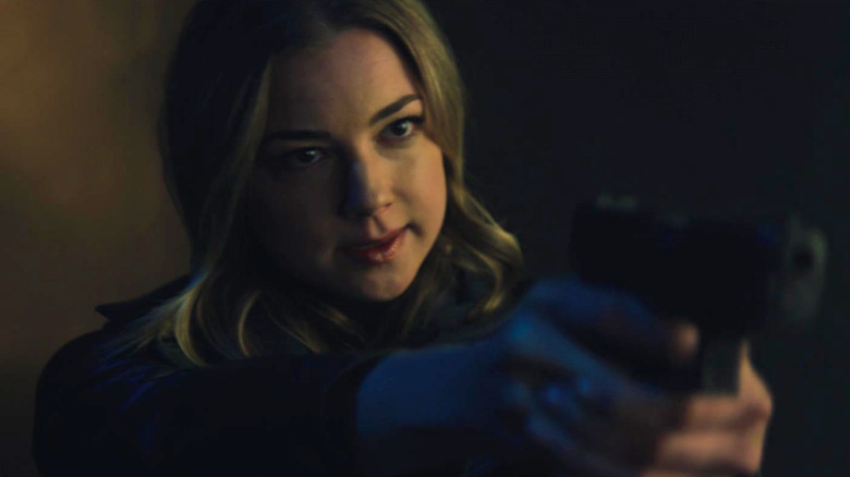 Sharon Carter points gun