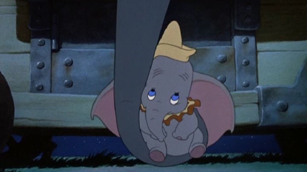 Mother elephant holds Dumbo