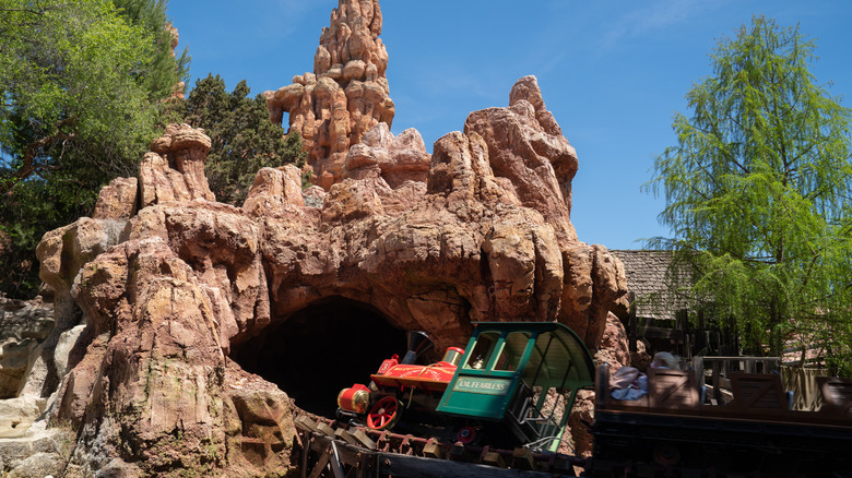 A train travels along Big Thunder Mountain Railroad