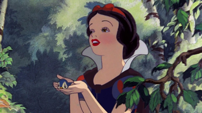 Snow White holding bluebird