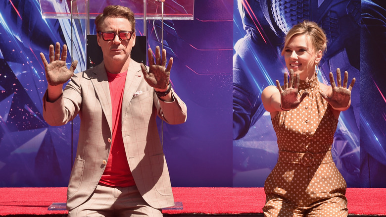 Robert and Scarlett hands up 