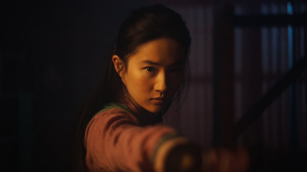 Mulan firing a bow and arrow