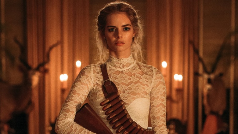 Samara Weaving with a shotgun