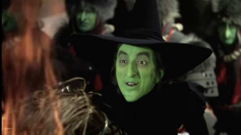 Wicked Witch holding flaming broom