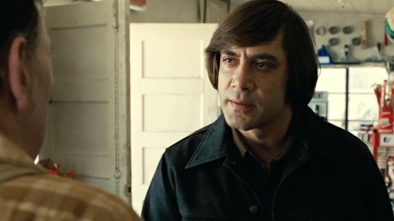 Anton Chigurh glaring at gas station attendant