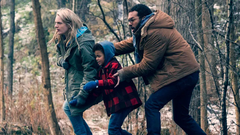 June, Hannah, and Luke run through the woods