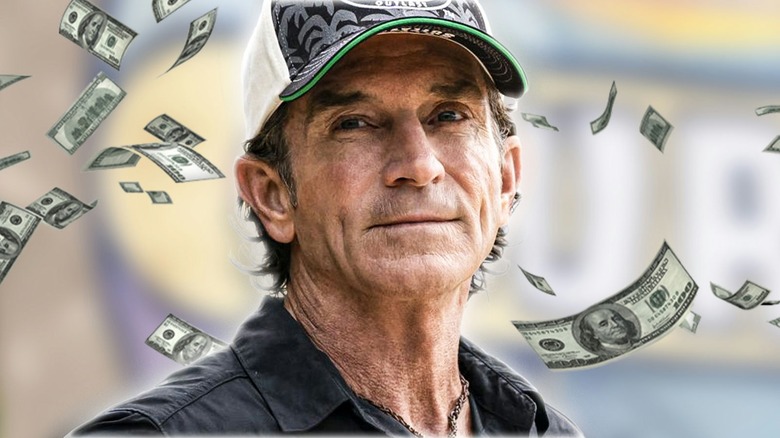 Jeff Probst with money floating around him