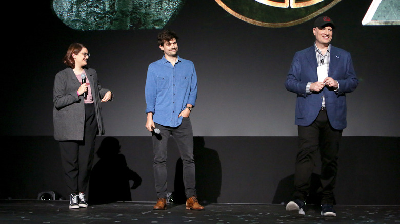 Kate Herron, Michael Waldron, and Kevin Feige speaking at event