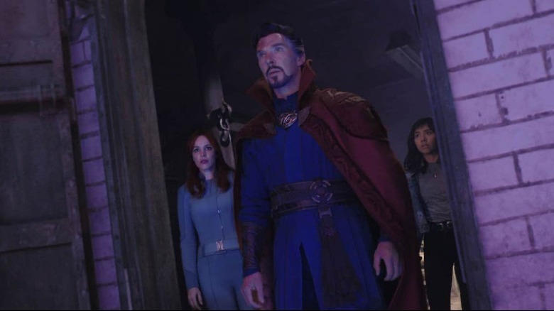 Doctor Strange, Christine Palmer, and America Chavez looking out of a door