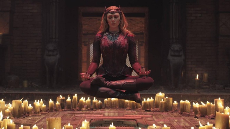 Scarlet Witch floating above candles