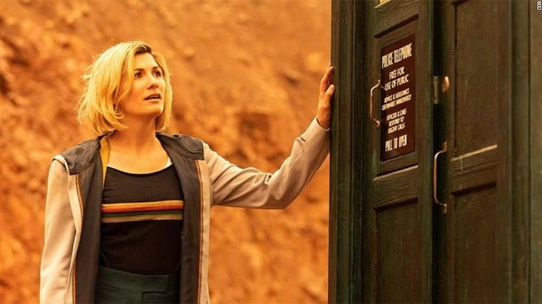 The Doctor touching the TARDIS