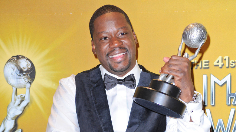 Daryl Mitchell with his NAACP image award on a red carpet in 2010