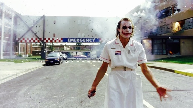 Joker walking down a street