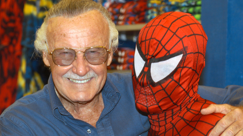 Stan Lee posing with Spider-Man